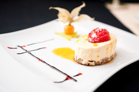 Sea buckthorn cheesecake on a plateの写真素材