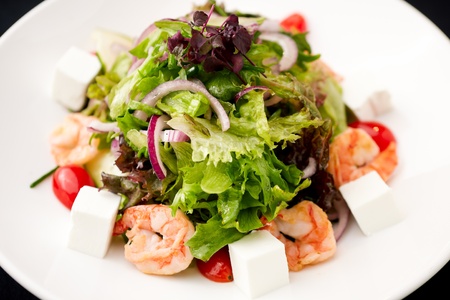 Greek salad with feta cheese and smoked shrimpの写真素材