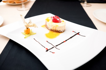 Sea buckthorn cheesecake on a plateの写真素材
