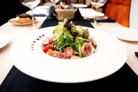 Green salad with Parma ham and melonの写真素材