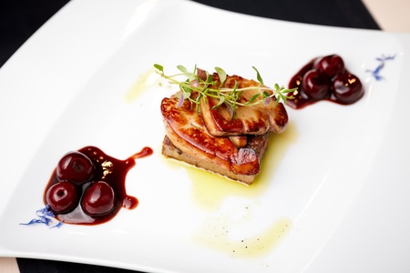 Fried foie gras with cherry sauce and figsの写真素材