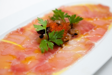 Salmon carpaccio with rocket saladの写真素材