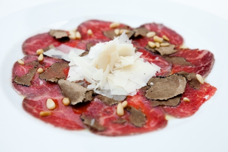 Beef carpaccio with salad and Parmesan cheeseの写真素材