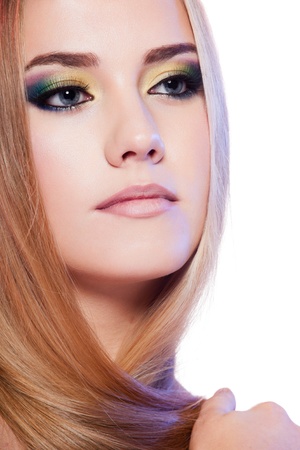 Beauty portrait of female model with colorful makeup on white backgroundの写真素材