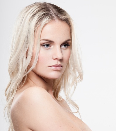 Portrait of a beautiful female model on gray backgroundの写真素材