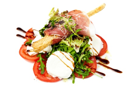 Caprese salad with ruccola and Parma hamの写真素材