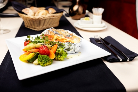 Baked in foil salmon with vegetablesの写真素材