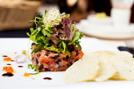 Salmon tartar with red caviar and ginger croutonsの写真素材