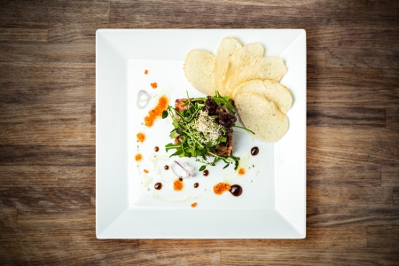 Salmon tartar with red caviar and ginger croutonsの写真素材