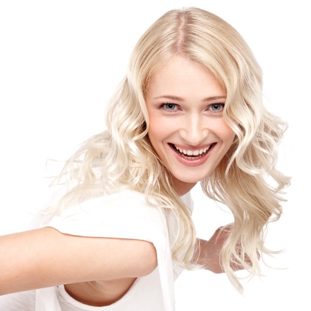 Young cute smiling girl isolated on whiteの写真素材