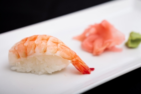 Shrimp sushi served on a plate with ginger and wasabiの写真素材