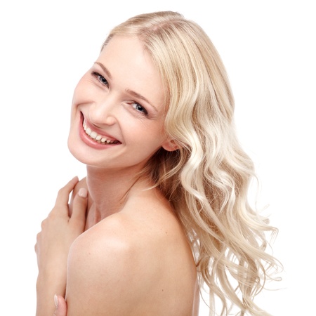 Young cute smiling girl isolated on whiteの写真素材