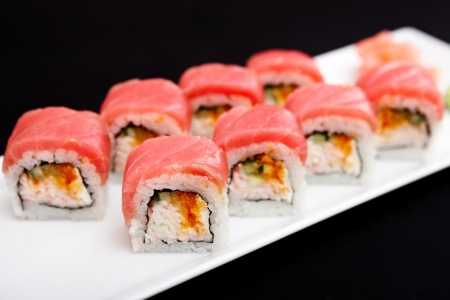 Tuna, soft crab, flying fish roe and spicy cream cheese rolls served on a plateの写真素材