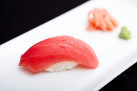 Red tuna sushi served on a plate with ginger and wasabiの写真素材