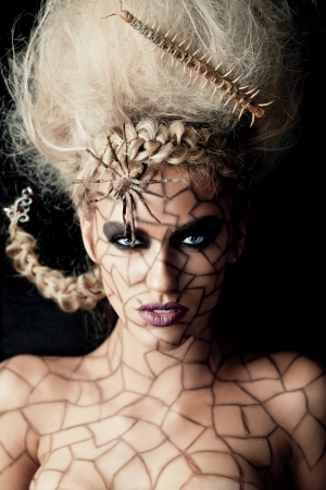 Portrait of a young girl with creative makeupの写真素材