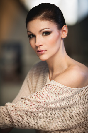 Portrait of a young lady in photostudio interiorの写真素材