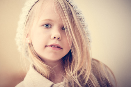 Portrait of an adorable preschool age girl in fashionable clothesの写真素材
