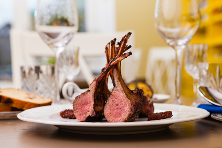 Lamb rack with limoncello glaze served on a plateの写真素材
