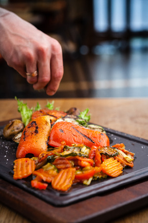 Grilled vegetables, baked in coal oven served on a warm plateの写真素材