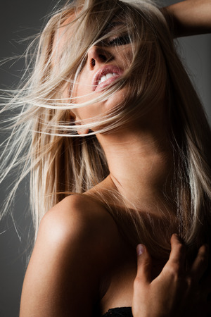 flying hair on greyの写真素材