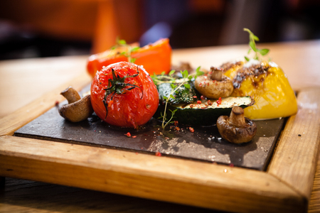 Grilled vegetables on a stone boardの写真素材