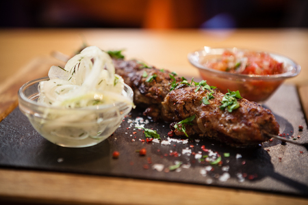 Lula kebab with tomato salsaの写真素材