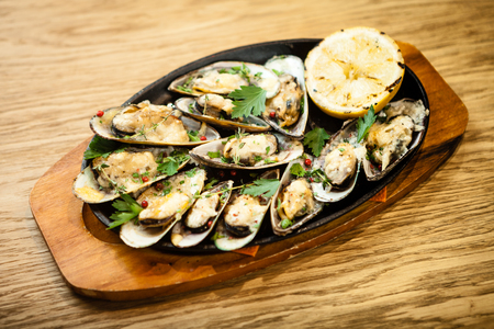 Baked mussels with cheeseの写真素材