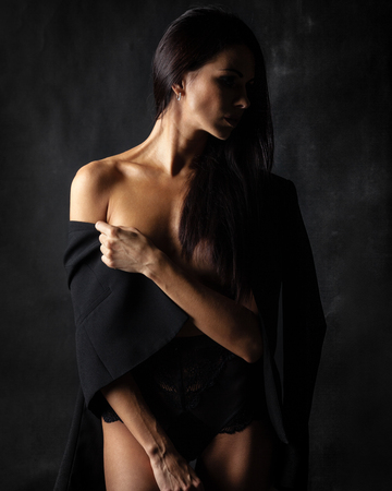 brunette lady with beautiful hair on blackの写真素材