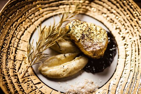 Black Angus tenderloin steak covered with 24 carat goldの写真素材
