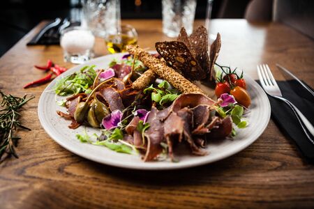 Meat platter for two served on a plate in restaurantの写真素材