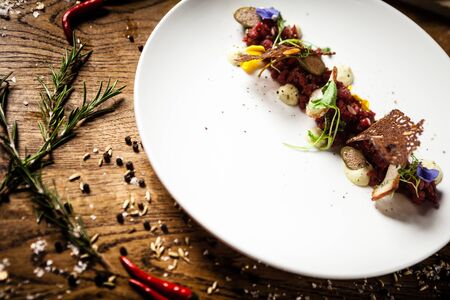 Steak tartare served on a plate in restaurantの写真素材