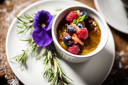Avocado creme brulee served in a cup in restaurantの写真素材