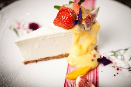 Grilled lamb chops served with a branch of rosemary on a black boardの写真素材