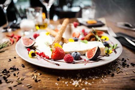 Cheese platter for two served on a plate in restaurantの写真素材