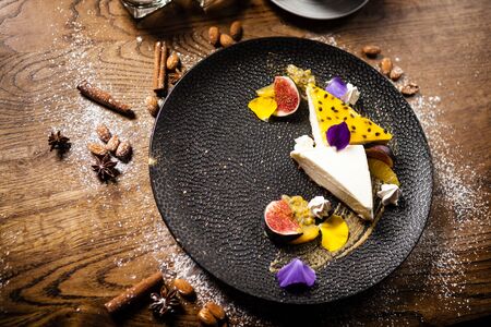 Cheesecake with passionfruit, fig and orangeの写真素材