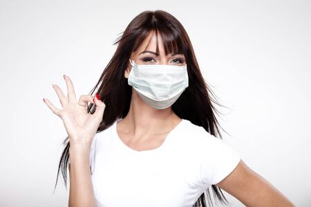 corona virus concept. woman in protective maskの写真素材