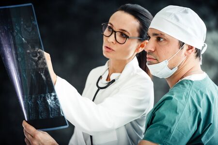 healthcare in hospital concept. two doctors reviewing x-ray resultsの写真素材