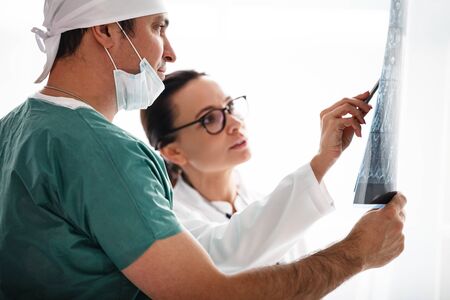 healthcare in hospital concept. two doctors reviewing x-ray resultsの写真素材