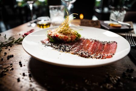 Tuna sashimi served on a plate in restaurantの写真素材