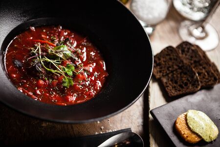 Beetroot soup Borscht with meat and sourcream served in restaurantの写真素材