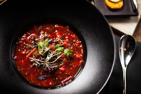 Beetroot soup served in a bowl in restaurantの写真素材