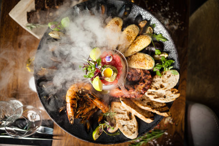 Seafood platter for 2-4 persons. Octopus, blue mussels, cooked green mussels, grilled tiger prawns,...