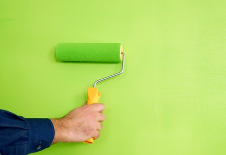 green wall painting with a toolの写真素材