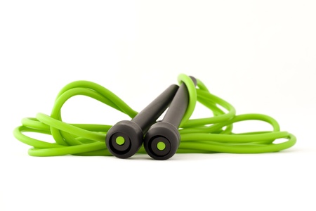 Green skipping rope for an exercise, isolated on white backgroundの写真素材