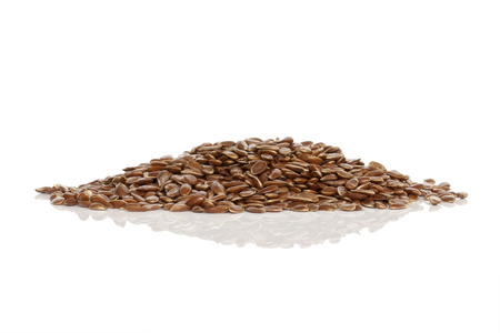 Flaxseeds isolated on white backgroundの写真素材
