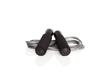 Black skipping rope for an exercise, isolated on white background.の写真素材