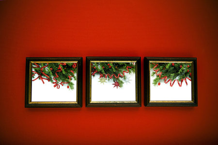 christmas frames on red wall