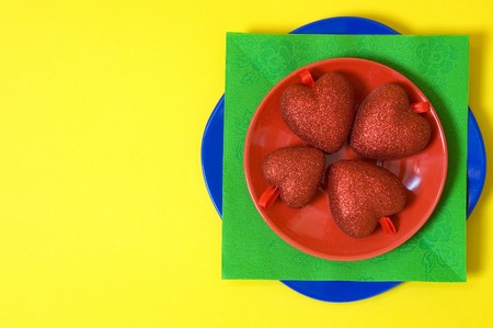 Valentines red heart in red plateの写真素材