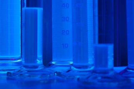test tubes in blue lightの写真素材