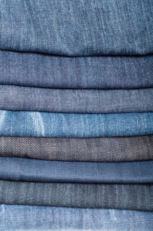  stack of denim blue jeansの写真素材
